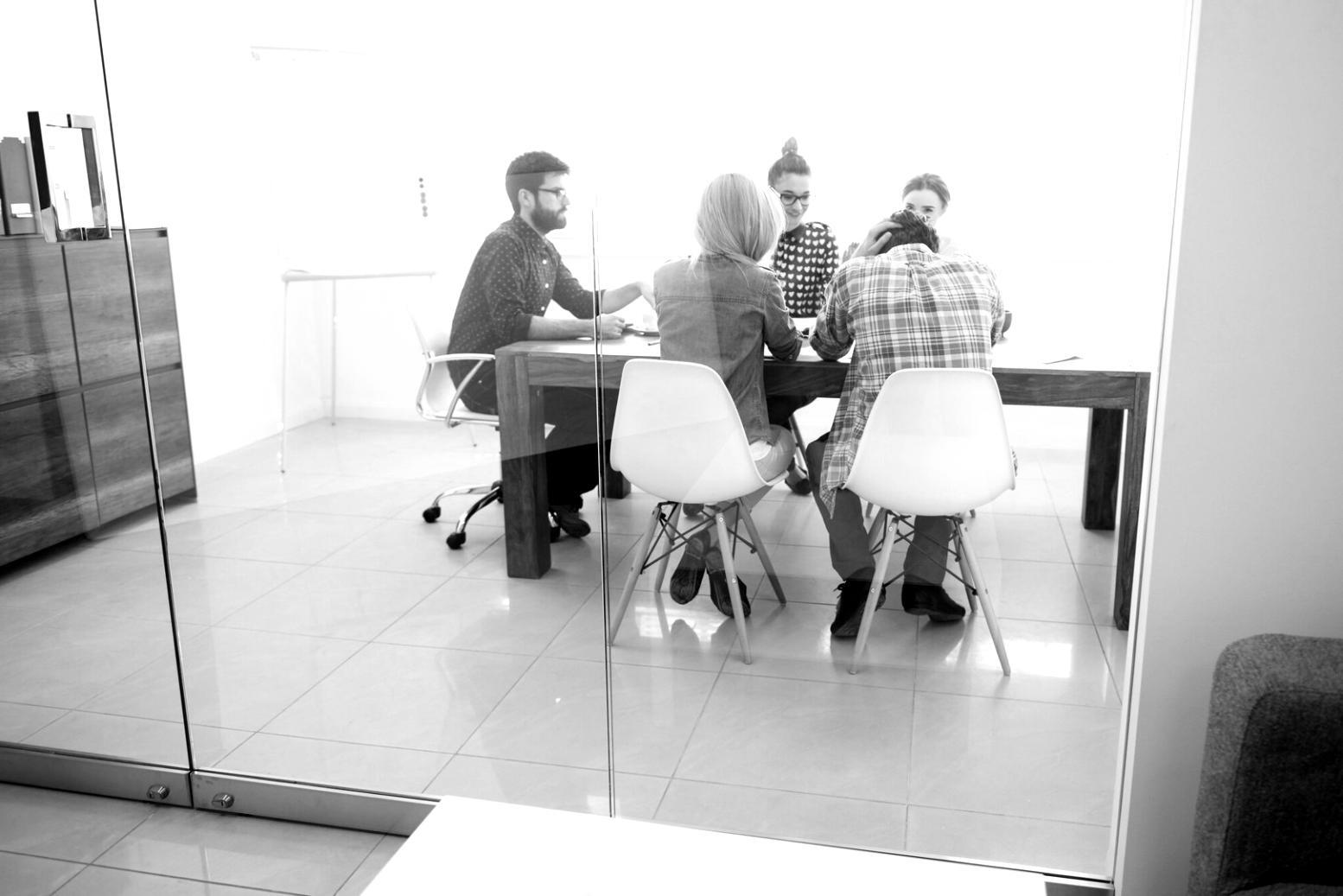 Business meeting discussing financial strategy and budget optimization