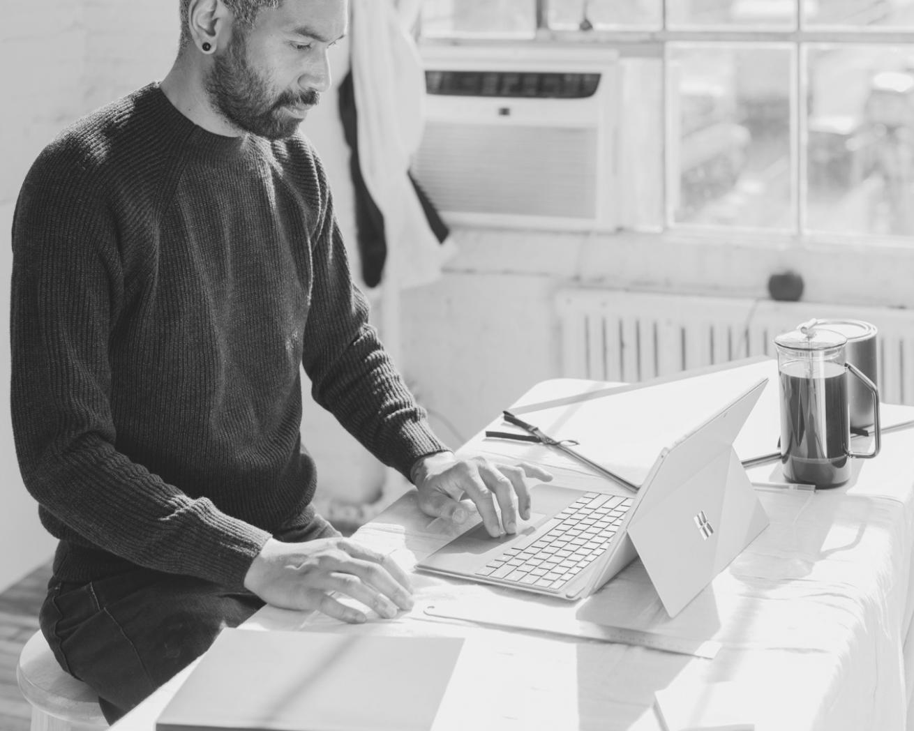 Student working on budget analysis exercises with instructor guidance